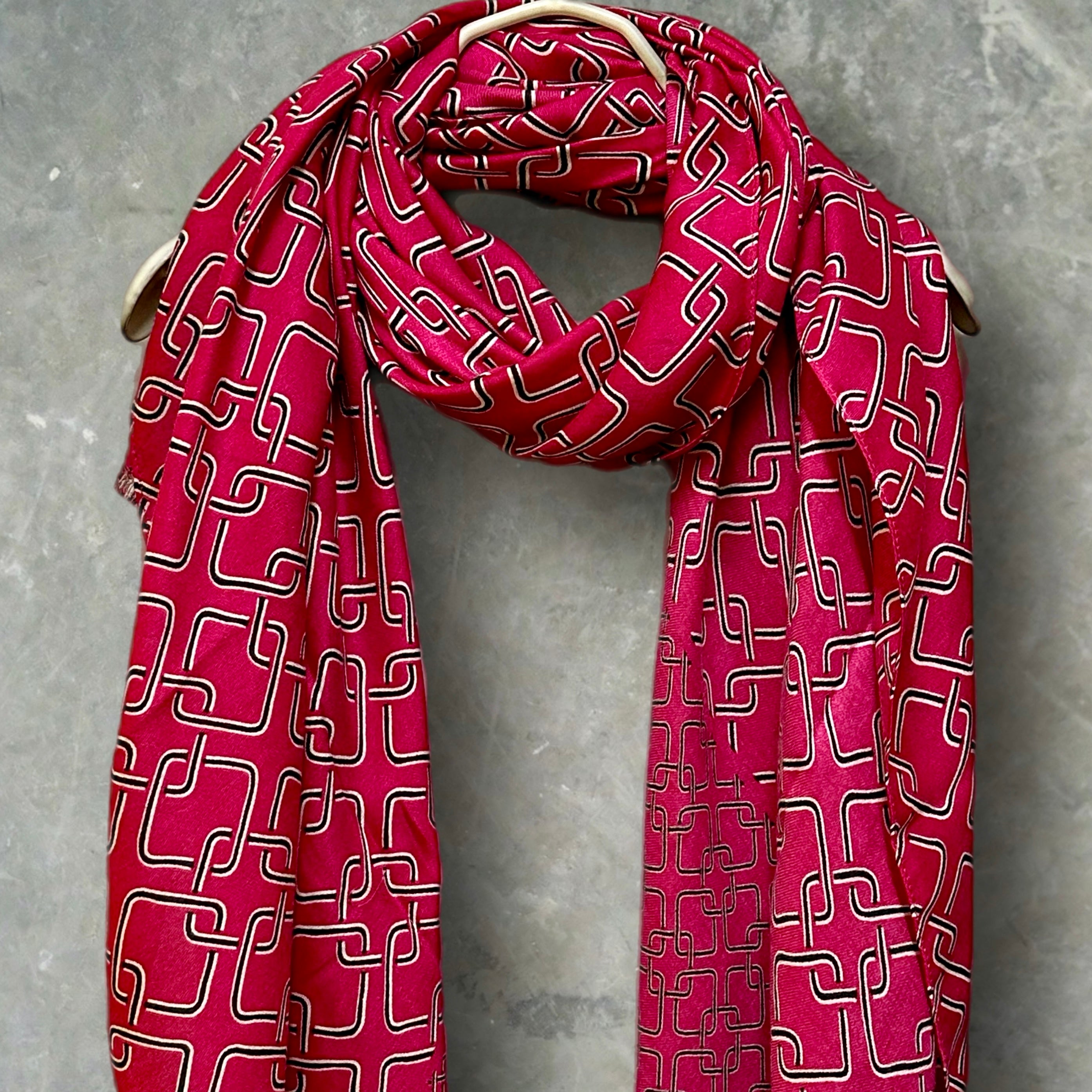 Stylish Pink Scarf Featuring Interlocking Design