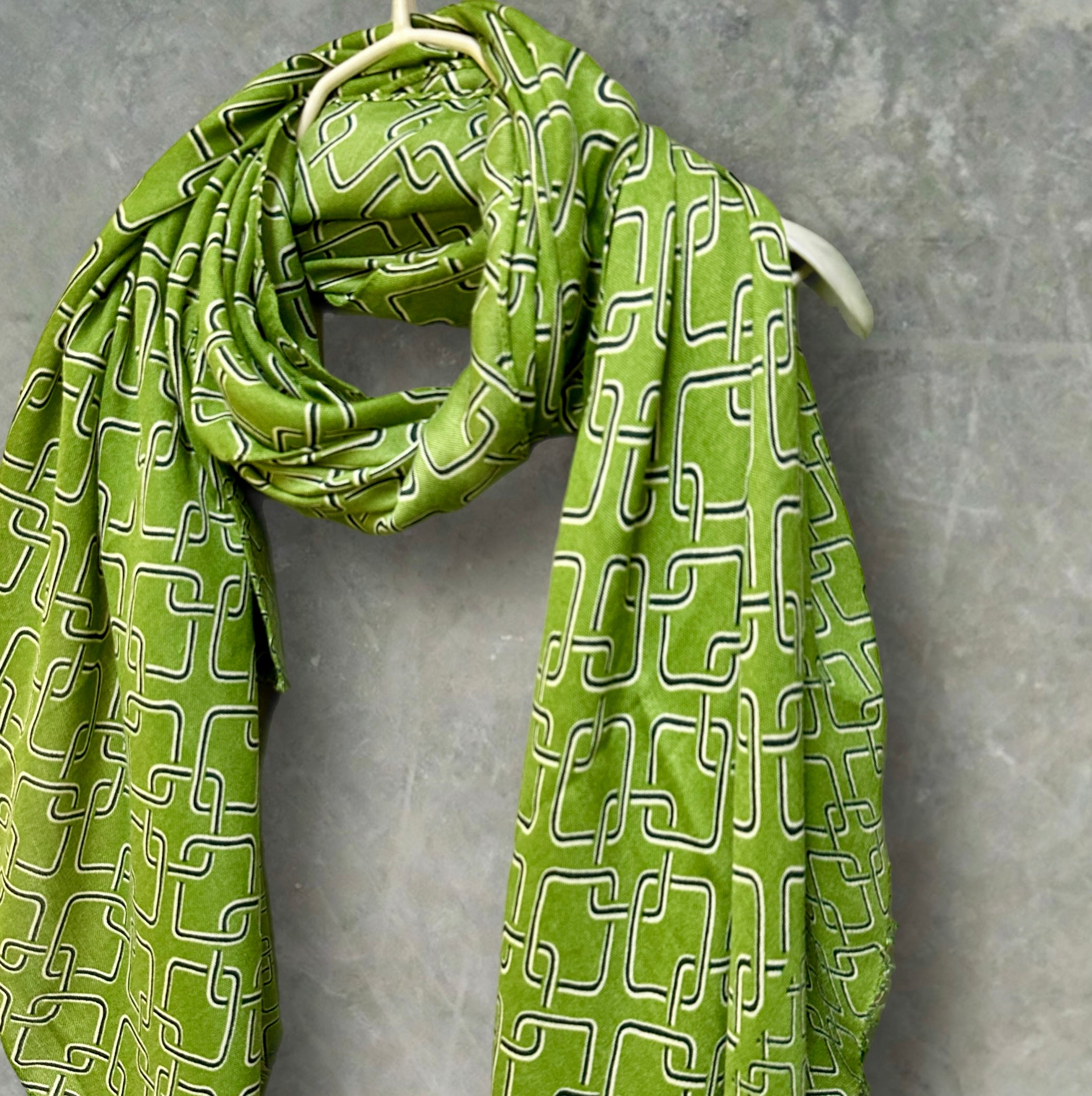 Stylish Green Scarf Featuring Interlocking Design