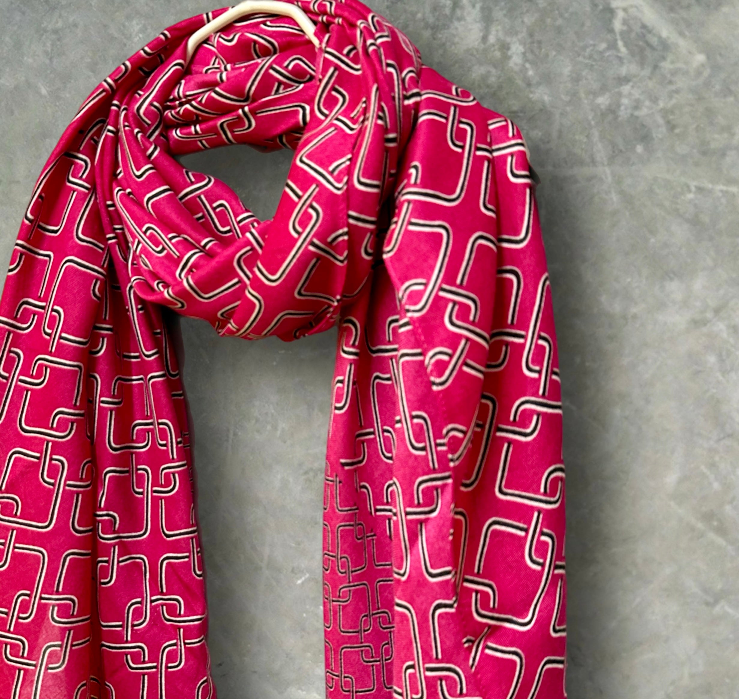 Stylish Pink Scarf Featuring Interlocking Design
