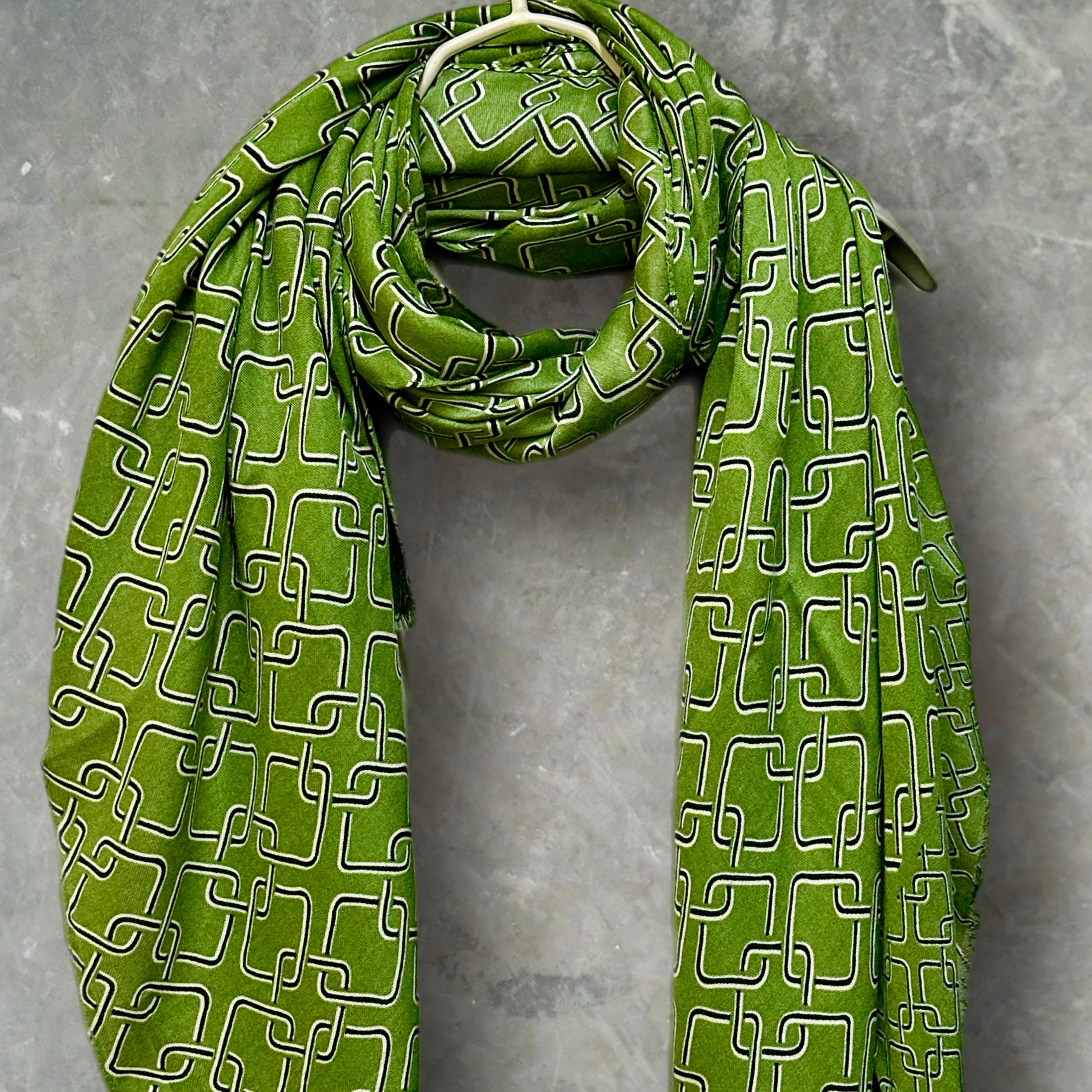 Stylish Green Scarf Featuring Interlocking Design