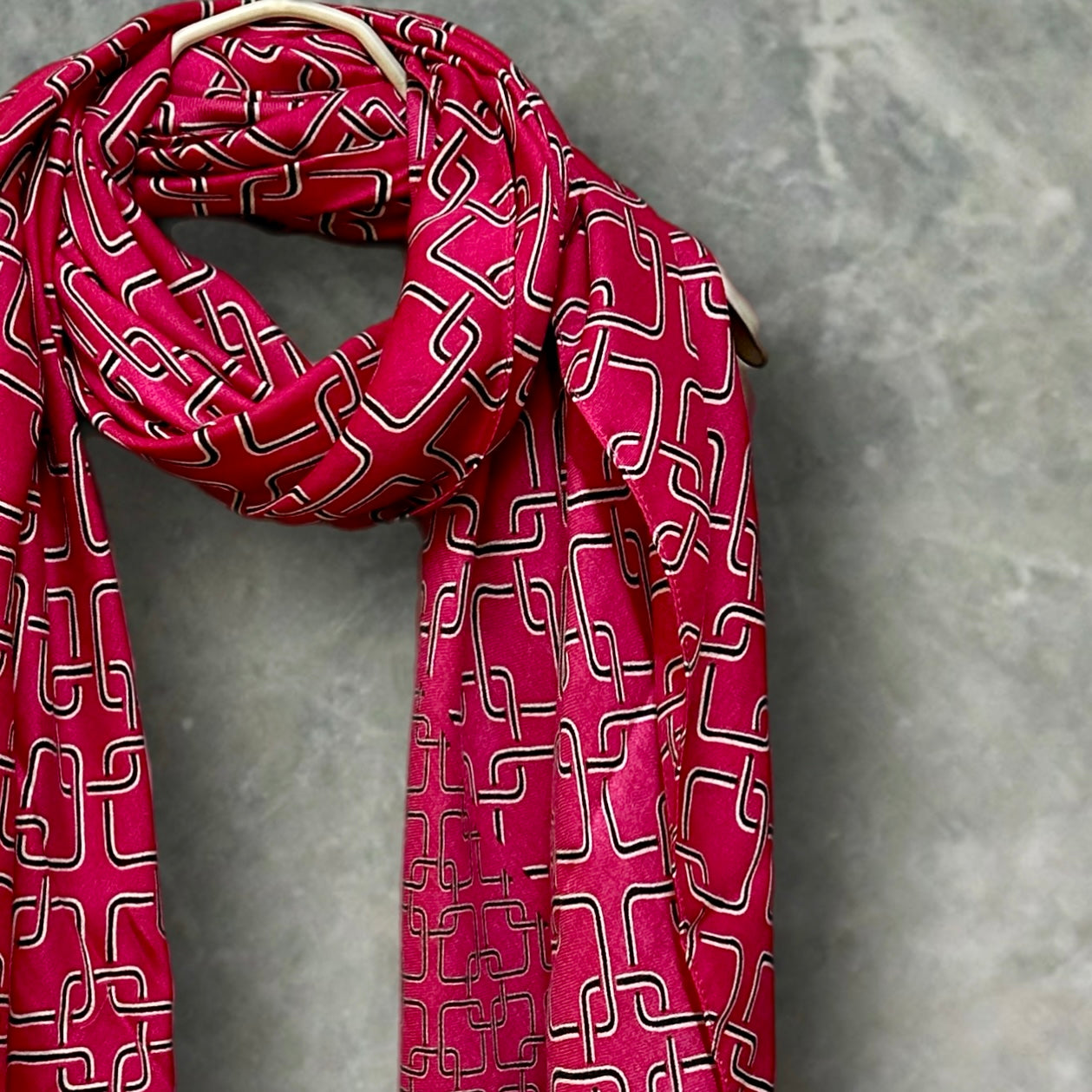 Stylish Pink Scarf Featuring Interlocking Design