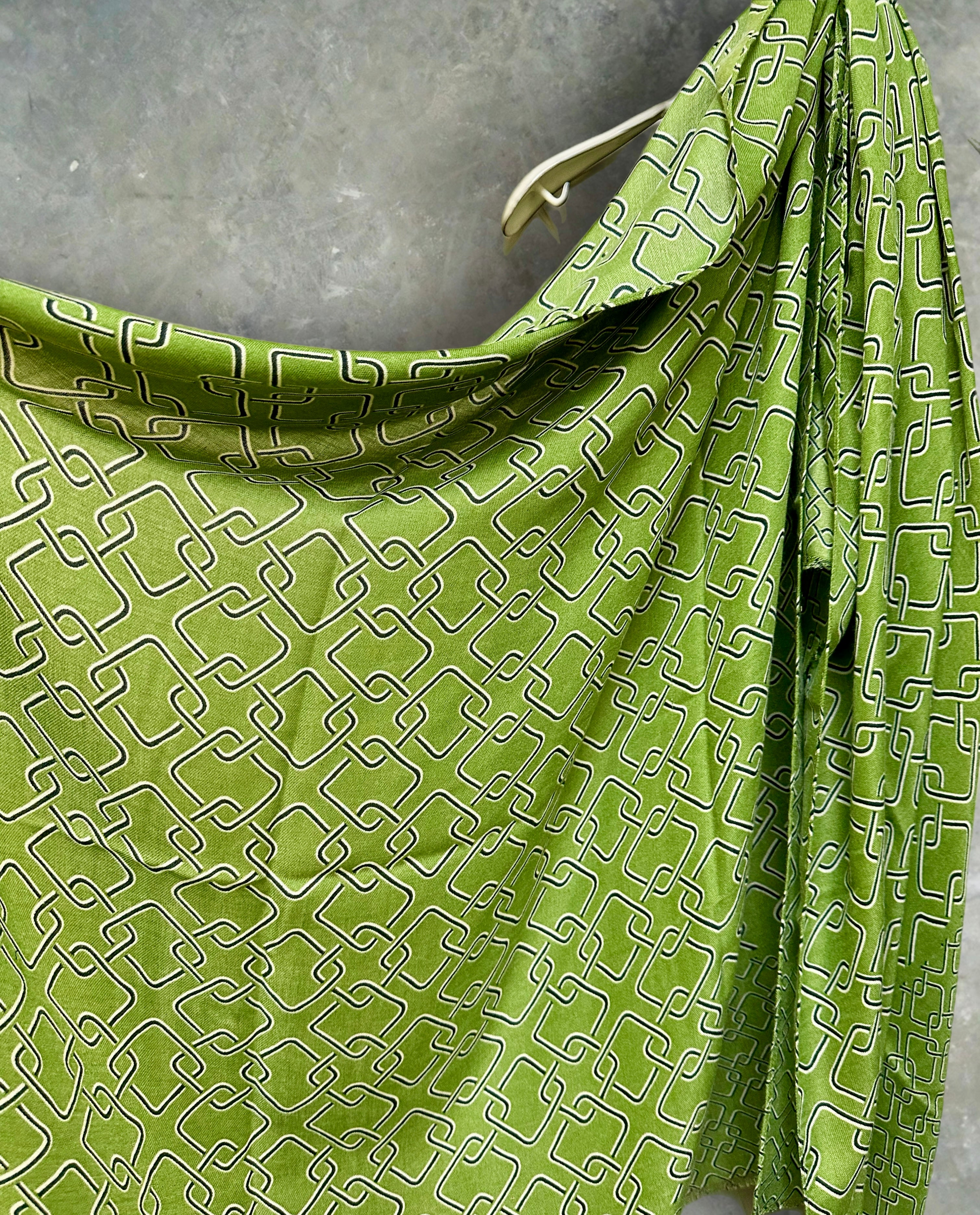 Stylish Green Scarf Featuring Interlocking Design
