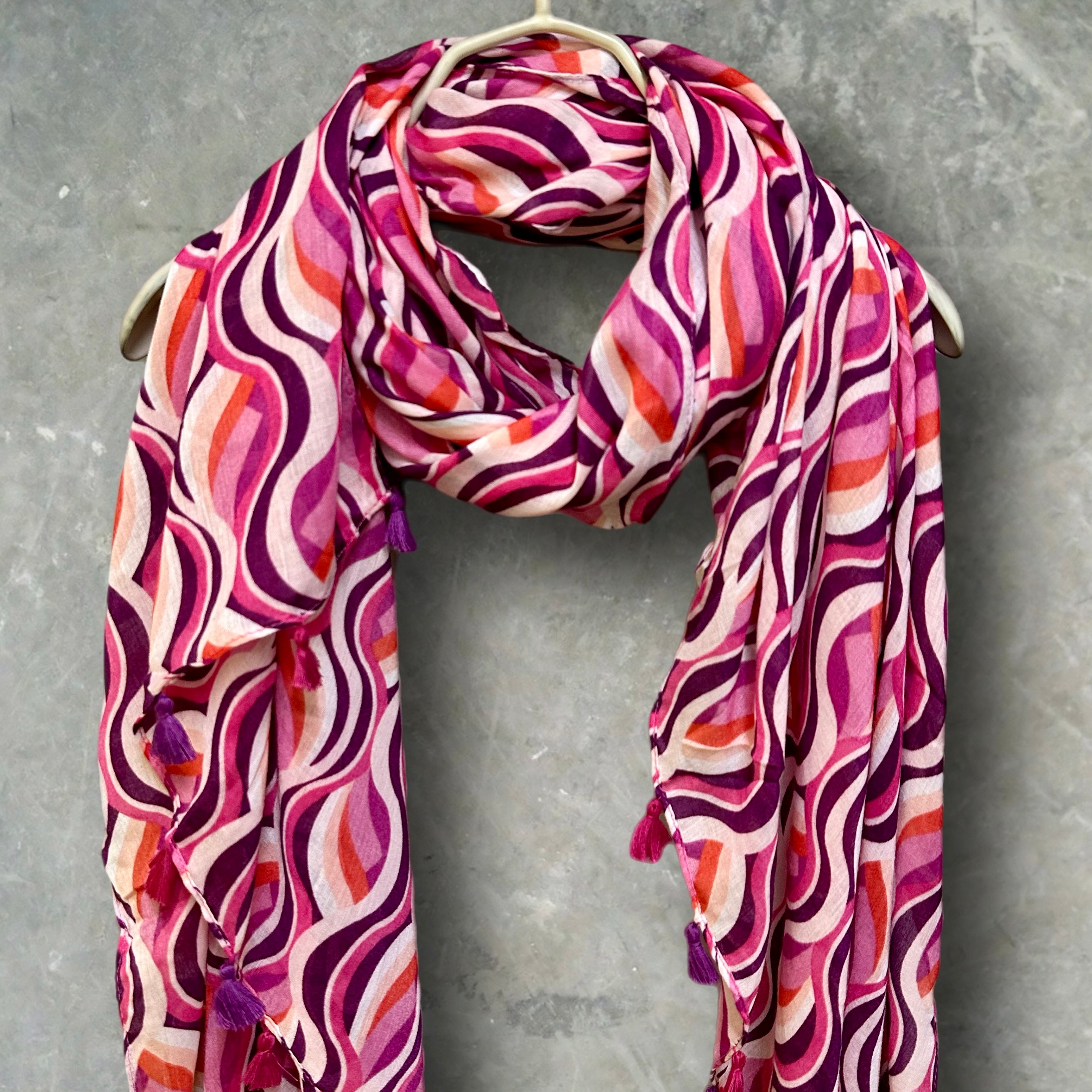 Versatile Pink Scarf Featuring Wavy Stripes