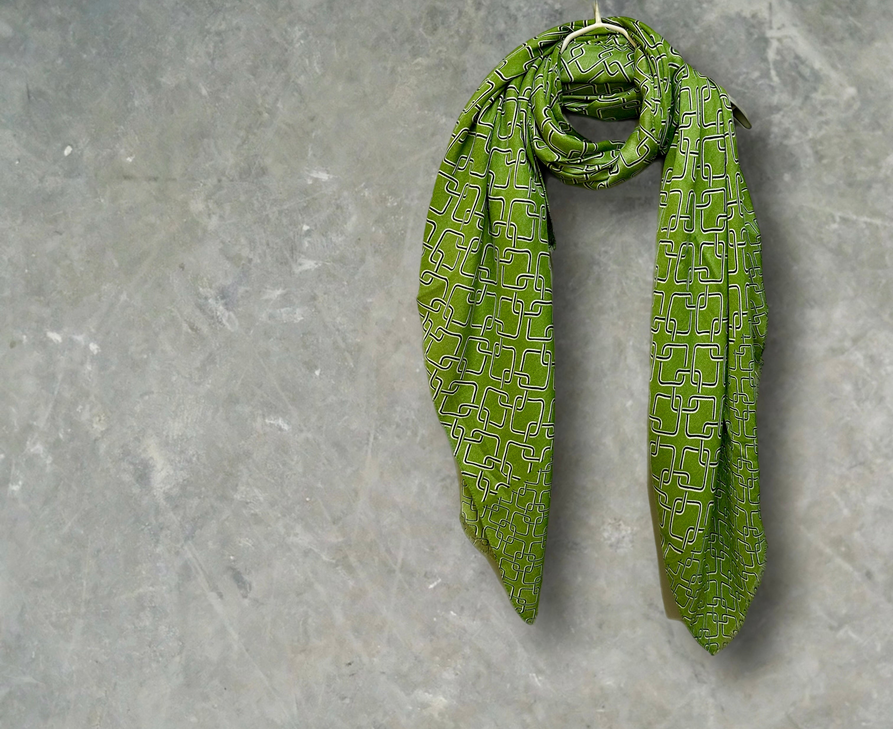 Stylish Green Scarf Featuring Interlocking Design