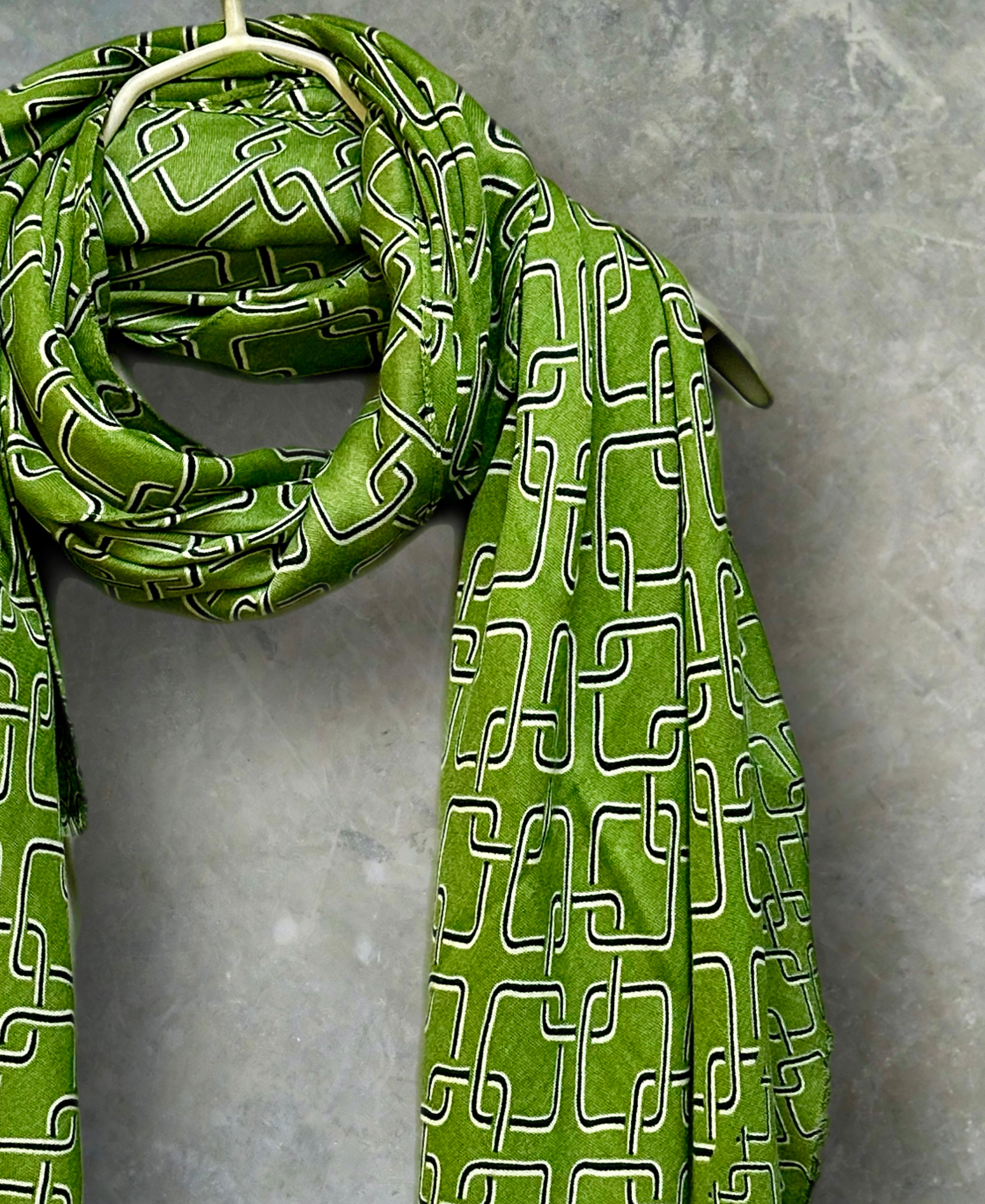 Stylish Green Scarf Featuring Interlocking Design