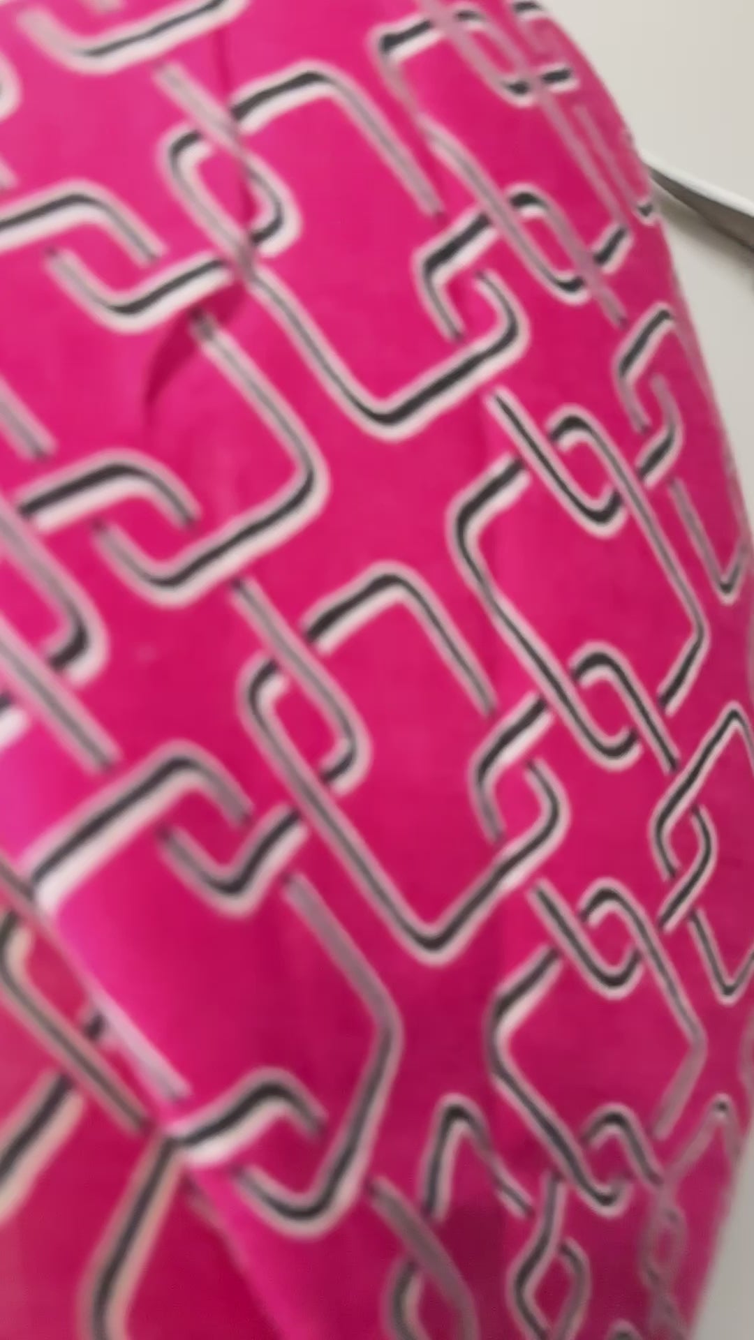 Stylish Pink Scarf Featuring Interlocking Design