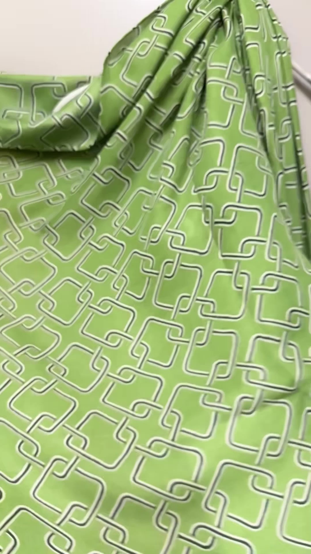 Stylish Green Scarf Featuring Interlocking Design